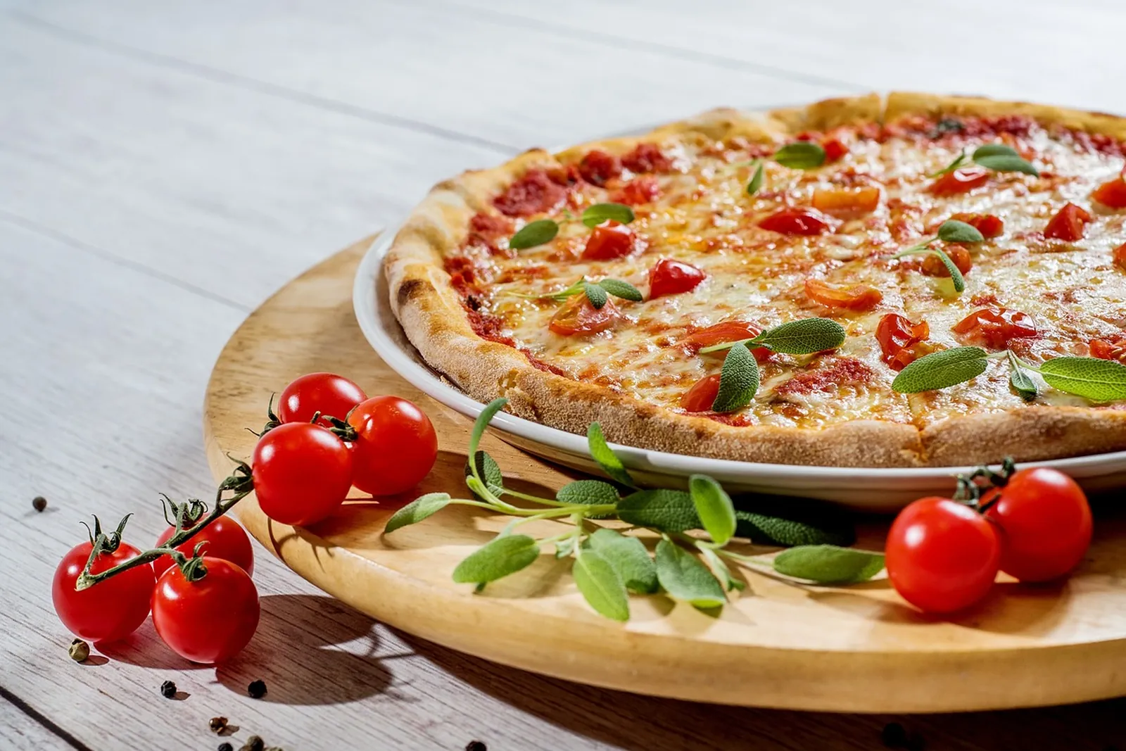 A tomato, mozzarella and basil pizza on a cafe table